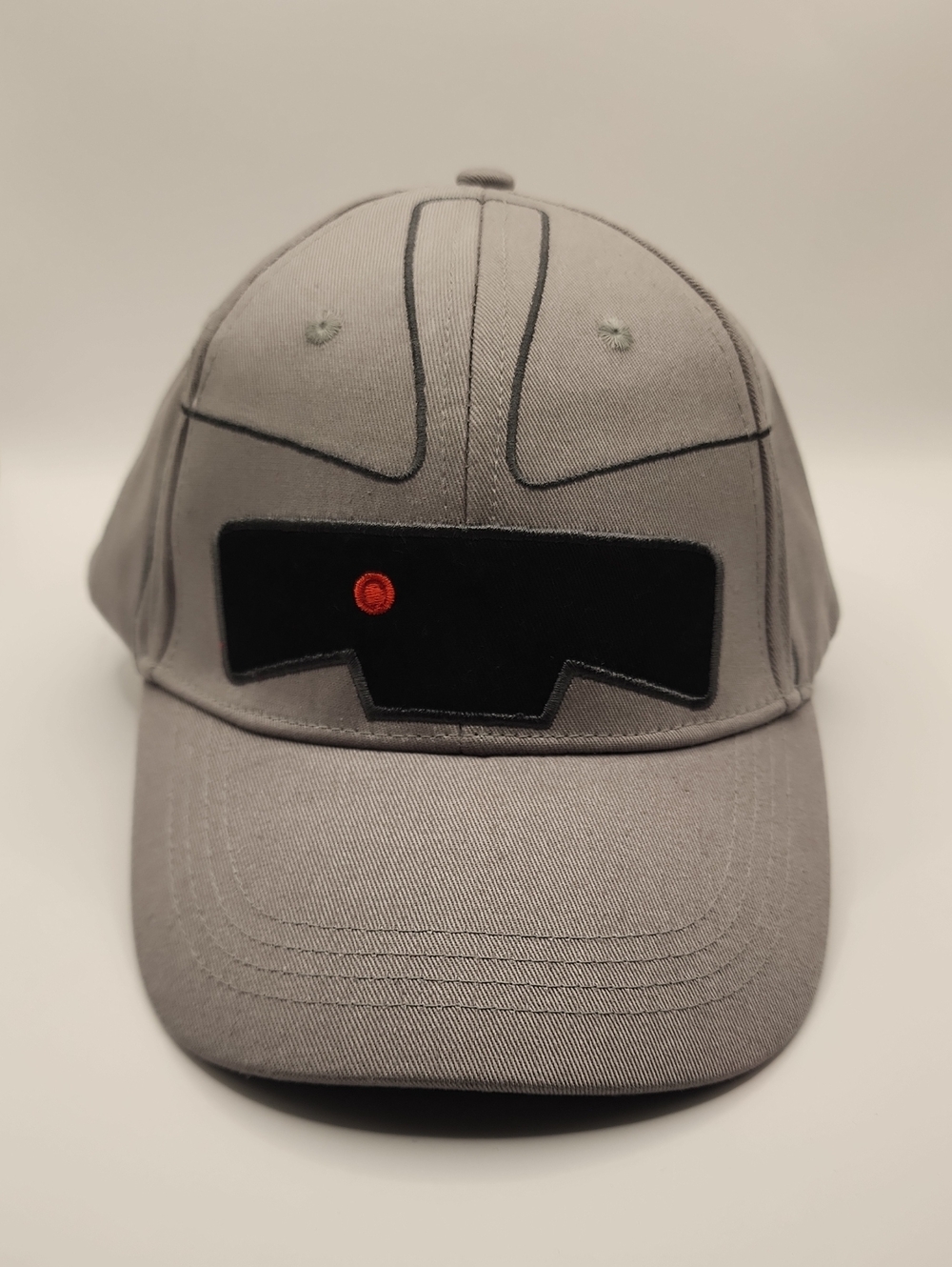 Gray Baseball Cap with Black Patch and Red Accent